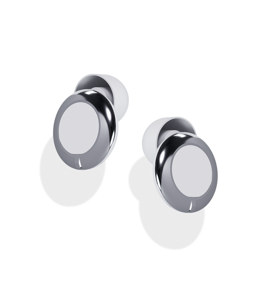 Pair of silver hearing aid buds on a white background